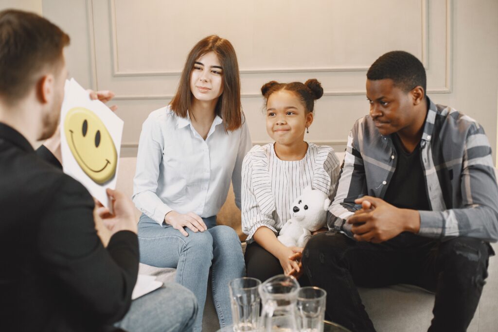 Interracial couple with a young child in a therapy session